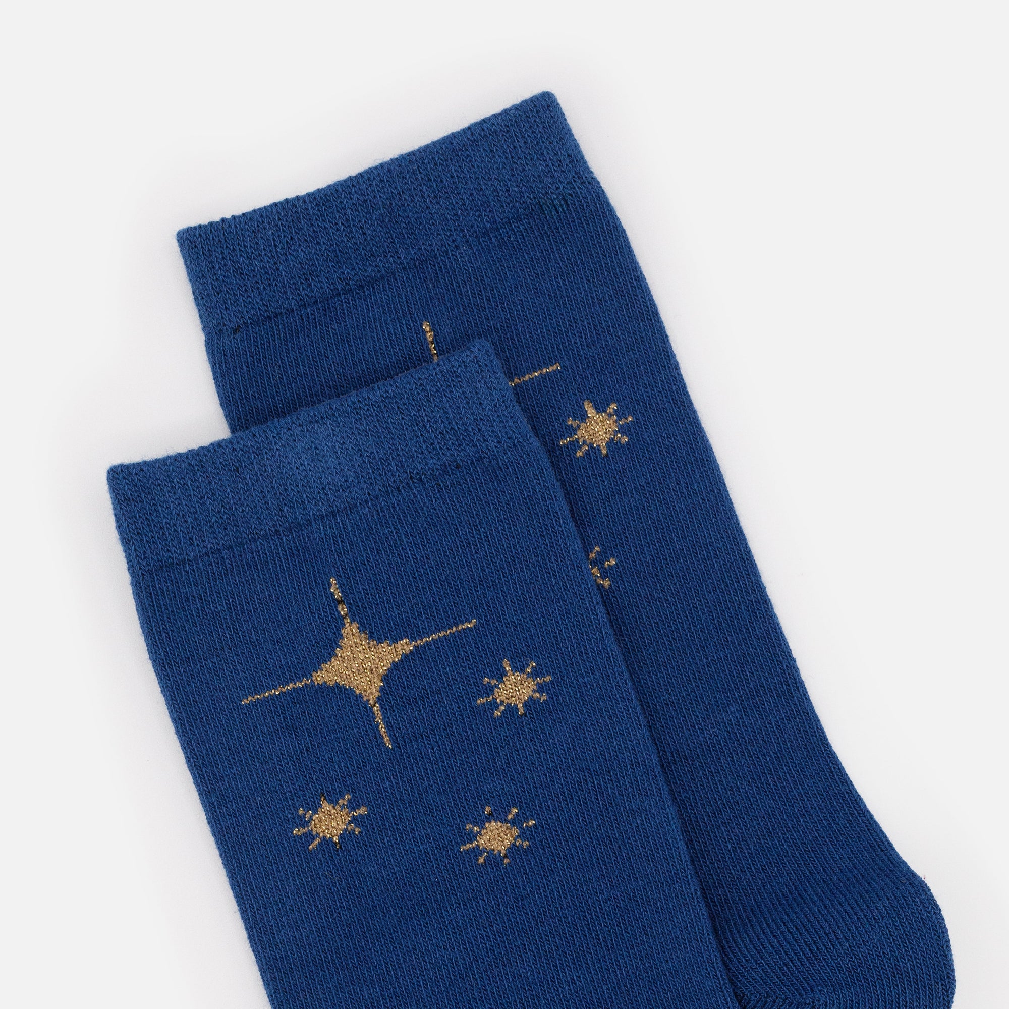 Bas bleu foncé avec étoiles dorées scintillantes