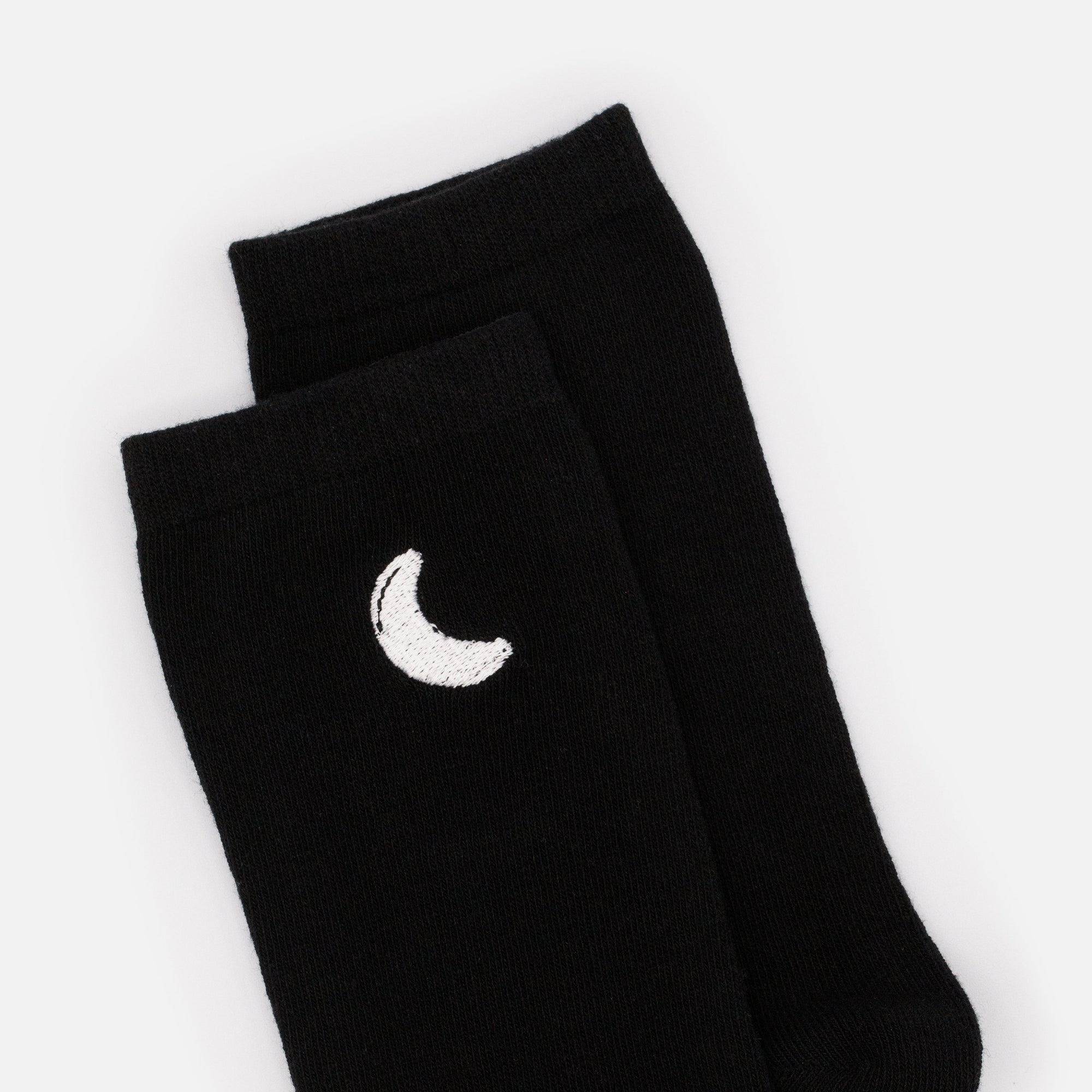 Black stockings with white crescent moon embroidery