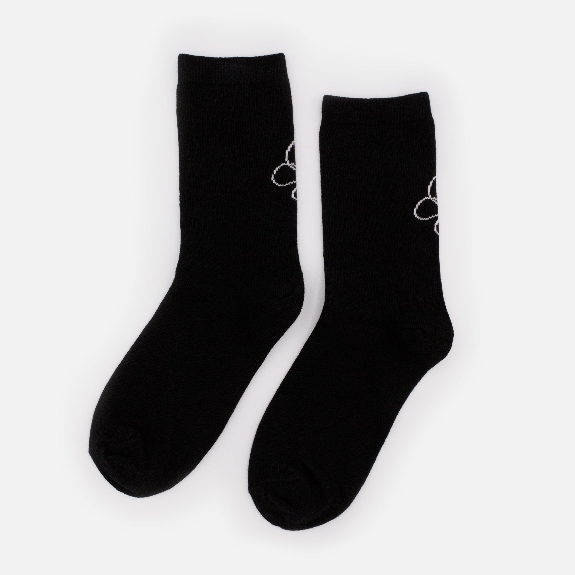 Bas noirs avec imprimé papillon blanc