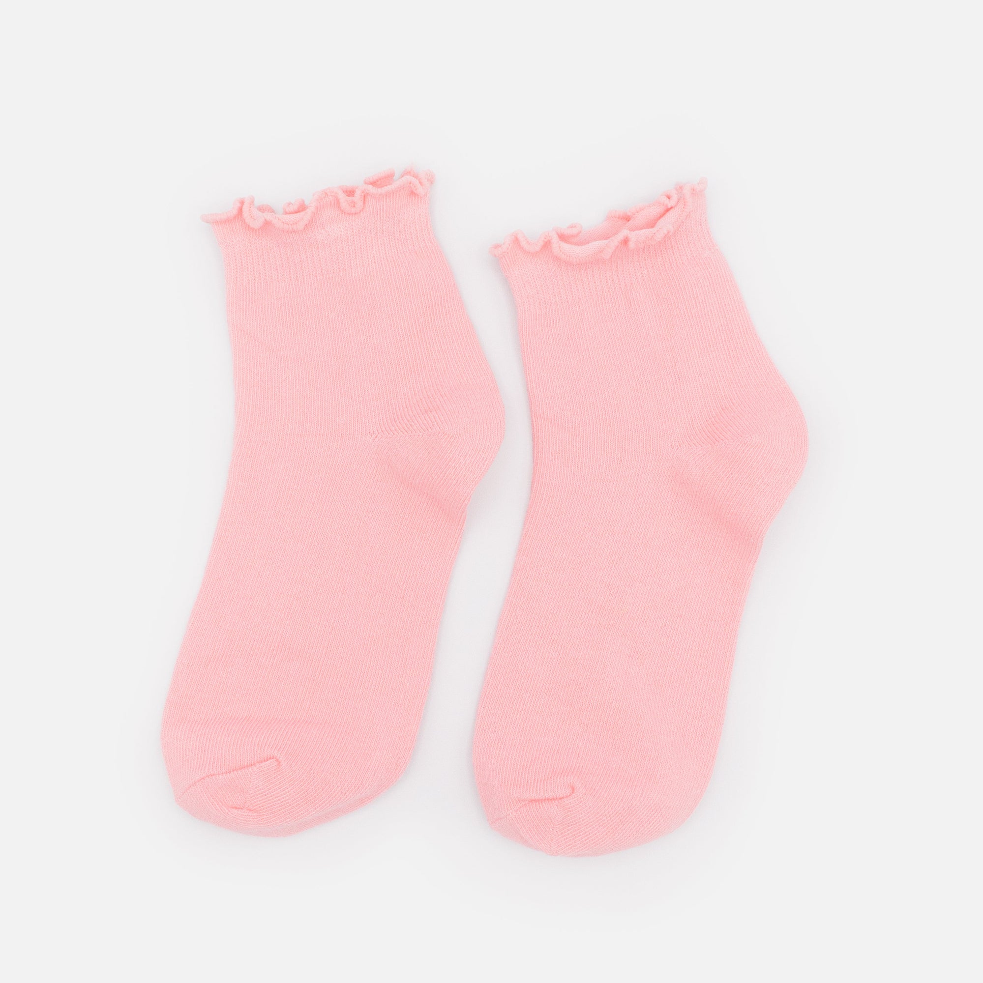 Bas cheville rose pâle à bordure ondulée