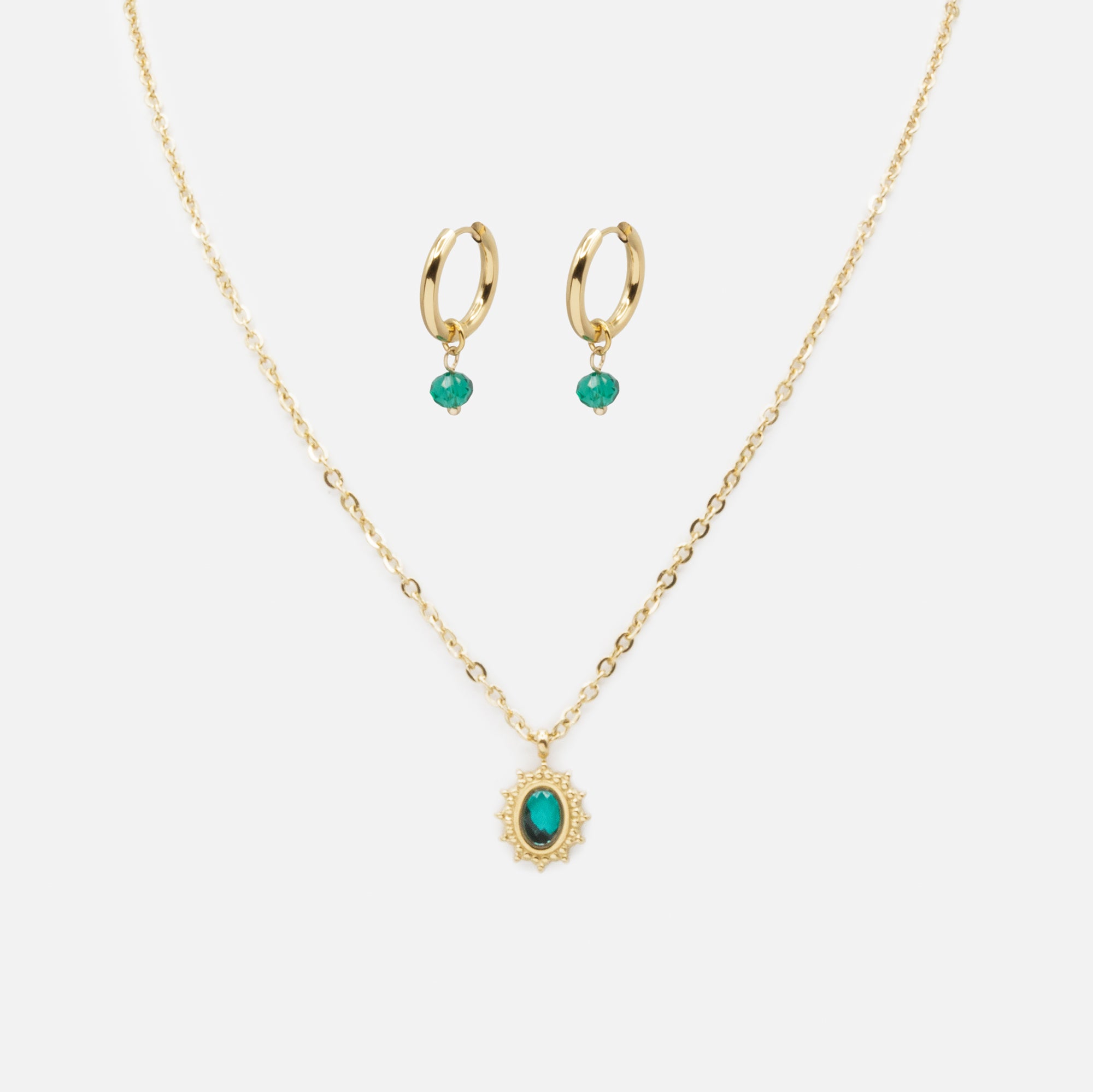 Gold ring necklace and earrings set with green stones in stainless steel