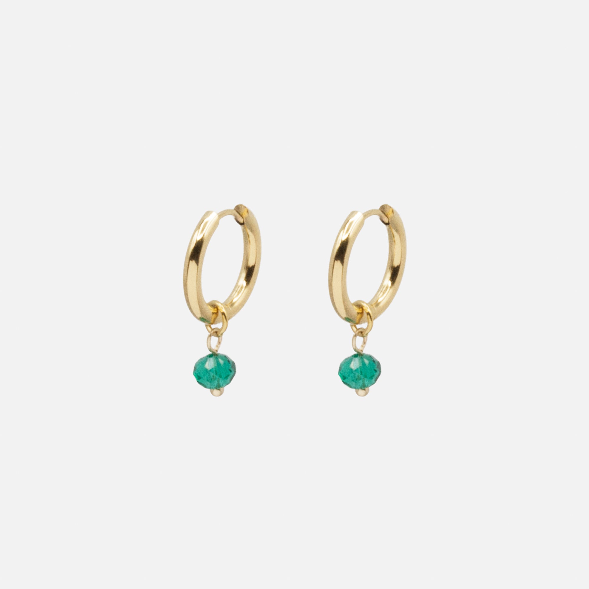 Gold ring necklace and earrings set with green stones in stainless steel