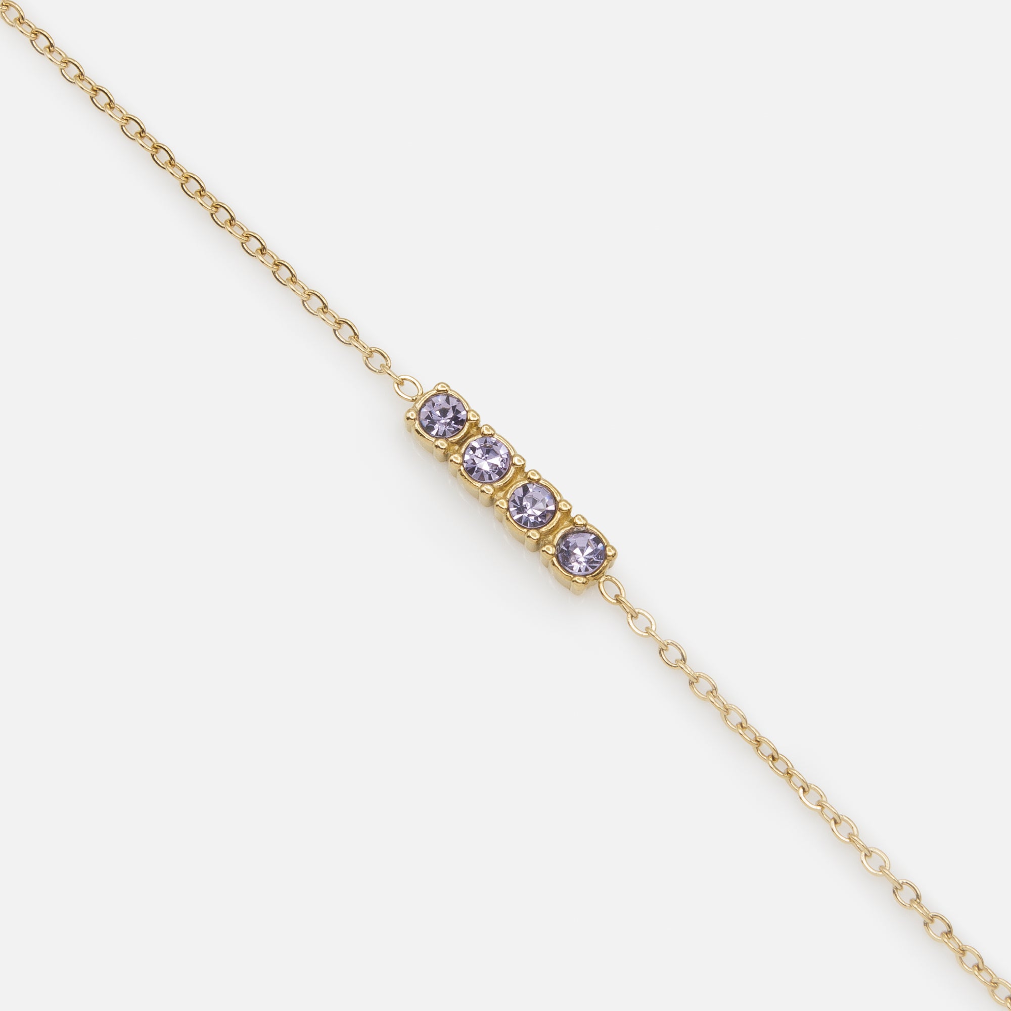 Golden bracelet and its quartet of purple cubic zirconia in stainless steel