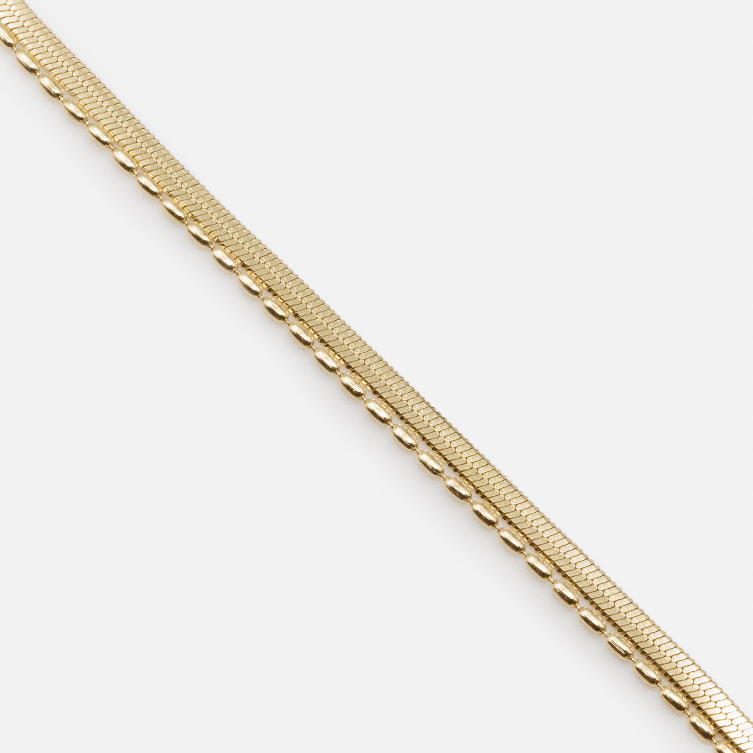 Bracelet doré double chaîne à mailles plates et billes allongées en acier inoxydable