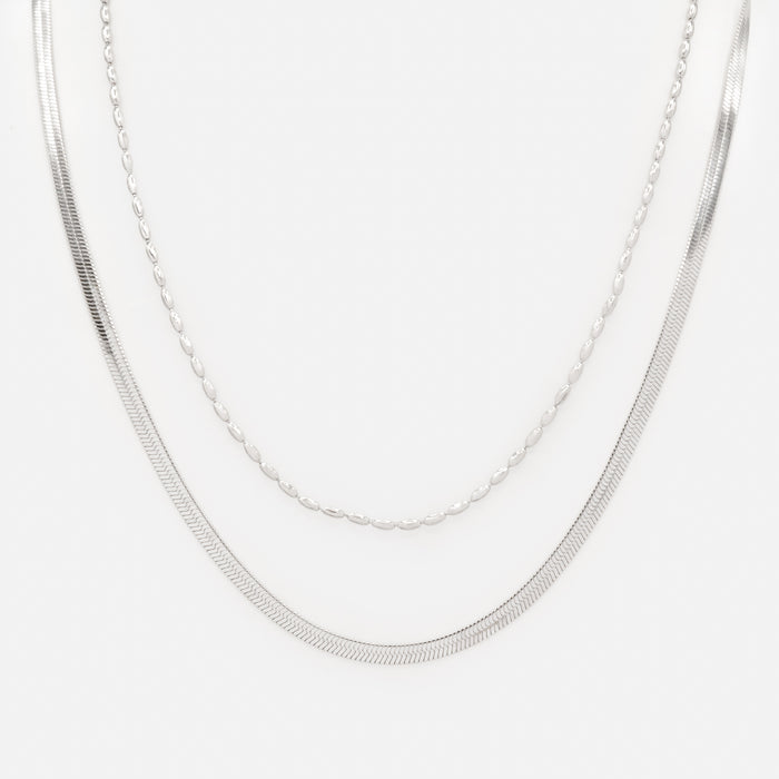 Collier argenté double chaîne à mailles plates et billes allongées en acier inoxydable