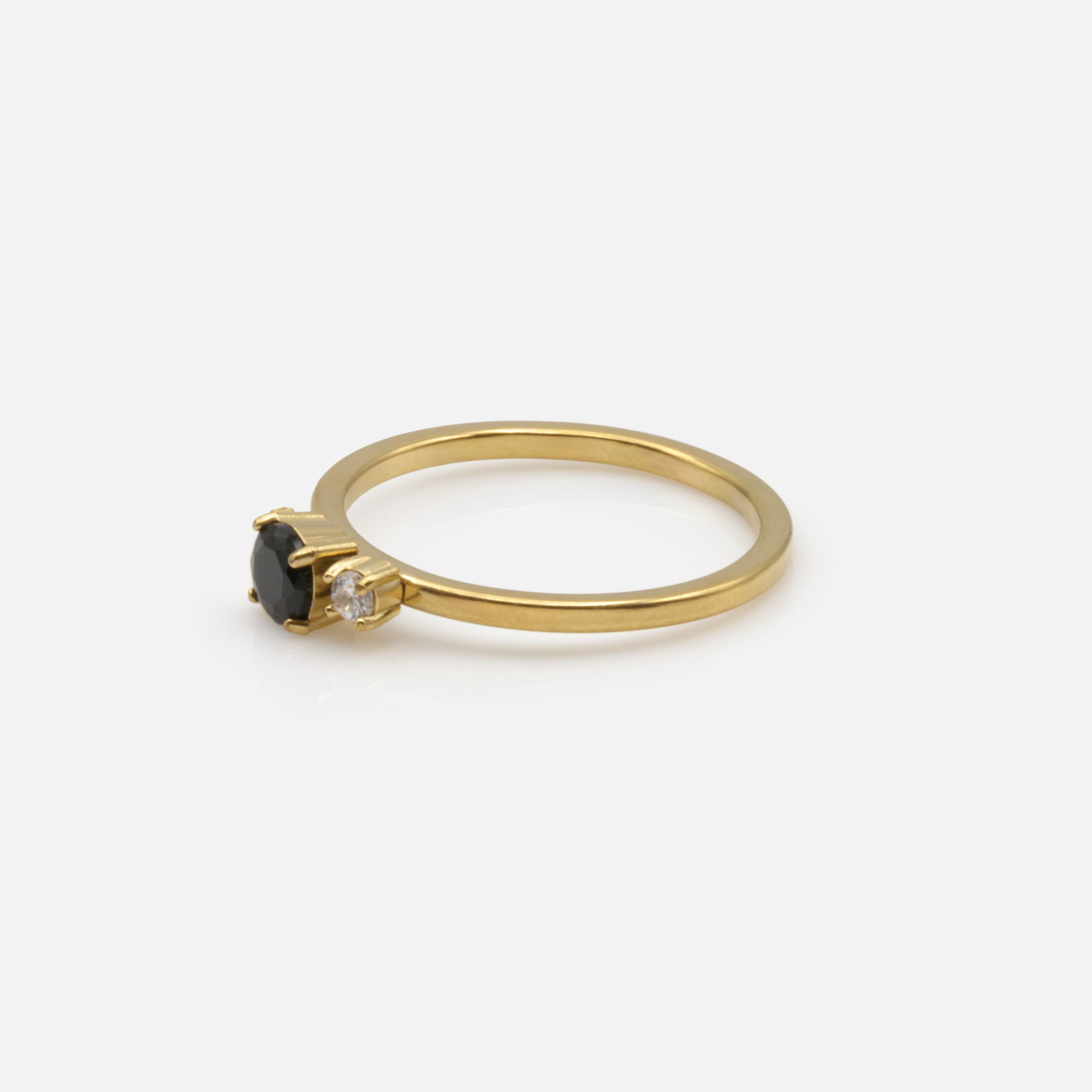 Gold ring with black and translucent zircons in stainless steel