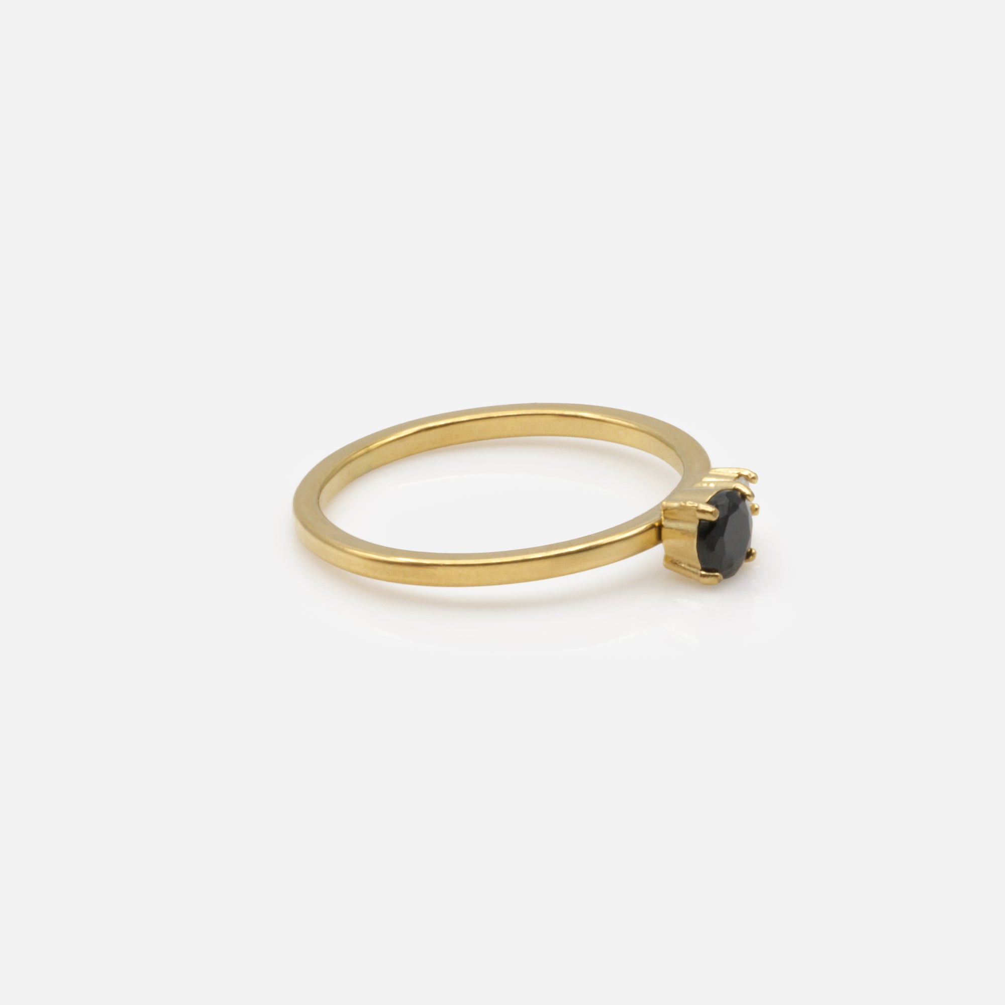 Gold ring with black and translucent zircons in stainless steel