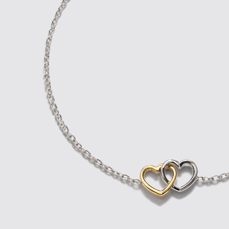 Bracelet argenté en acier inoxydable avec cœurs deux tons