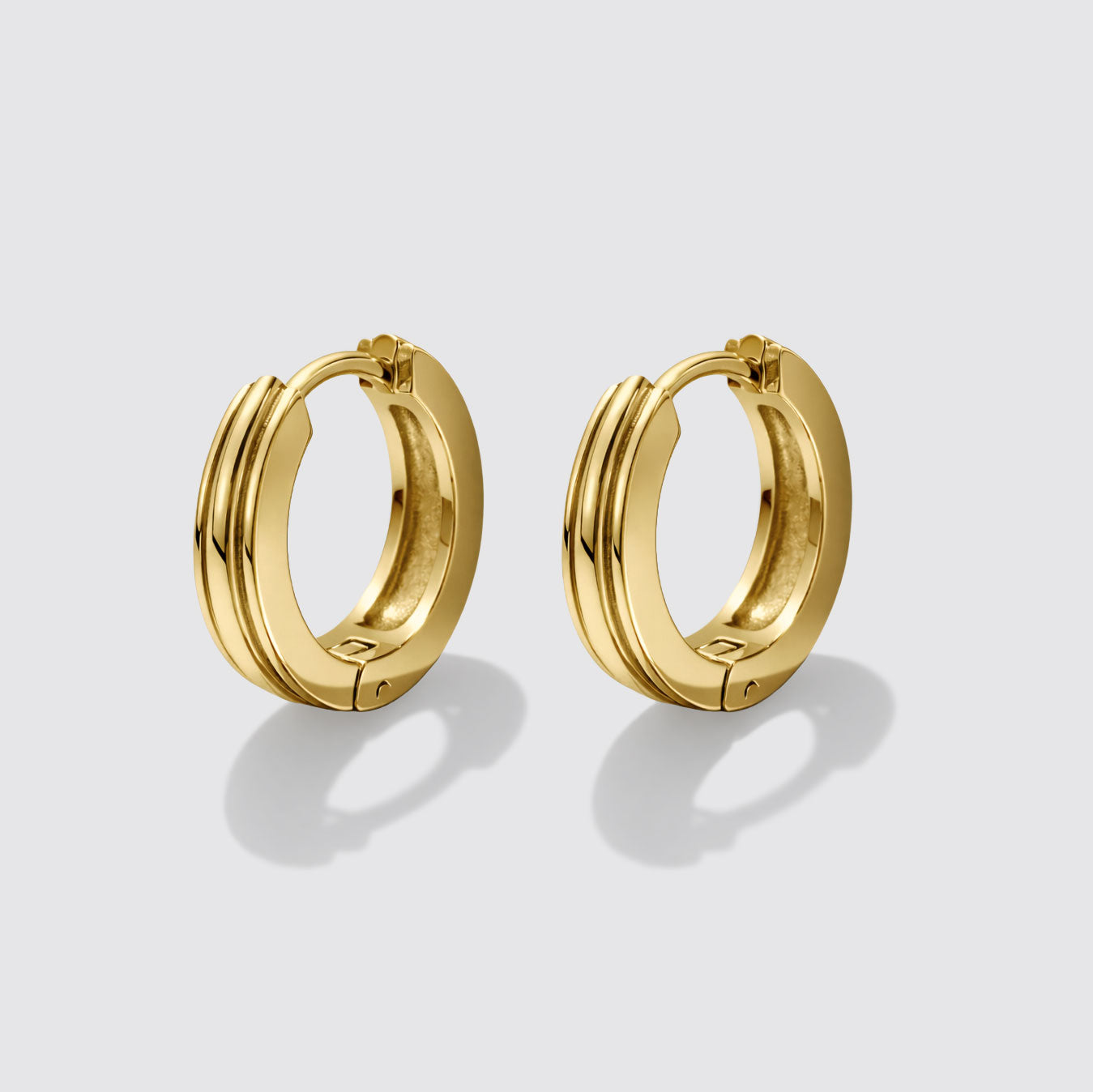 Boucles d'oreilles anneaux dorées à trois rangs en acier inoxydable
