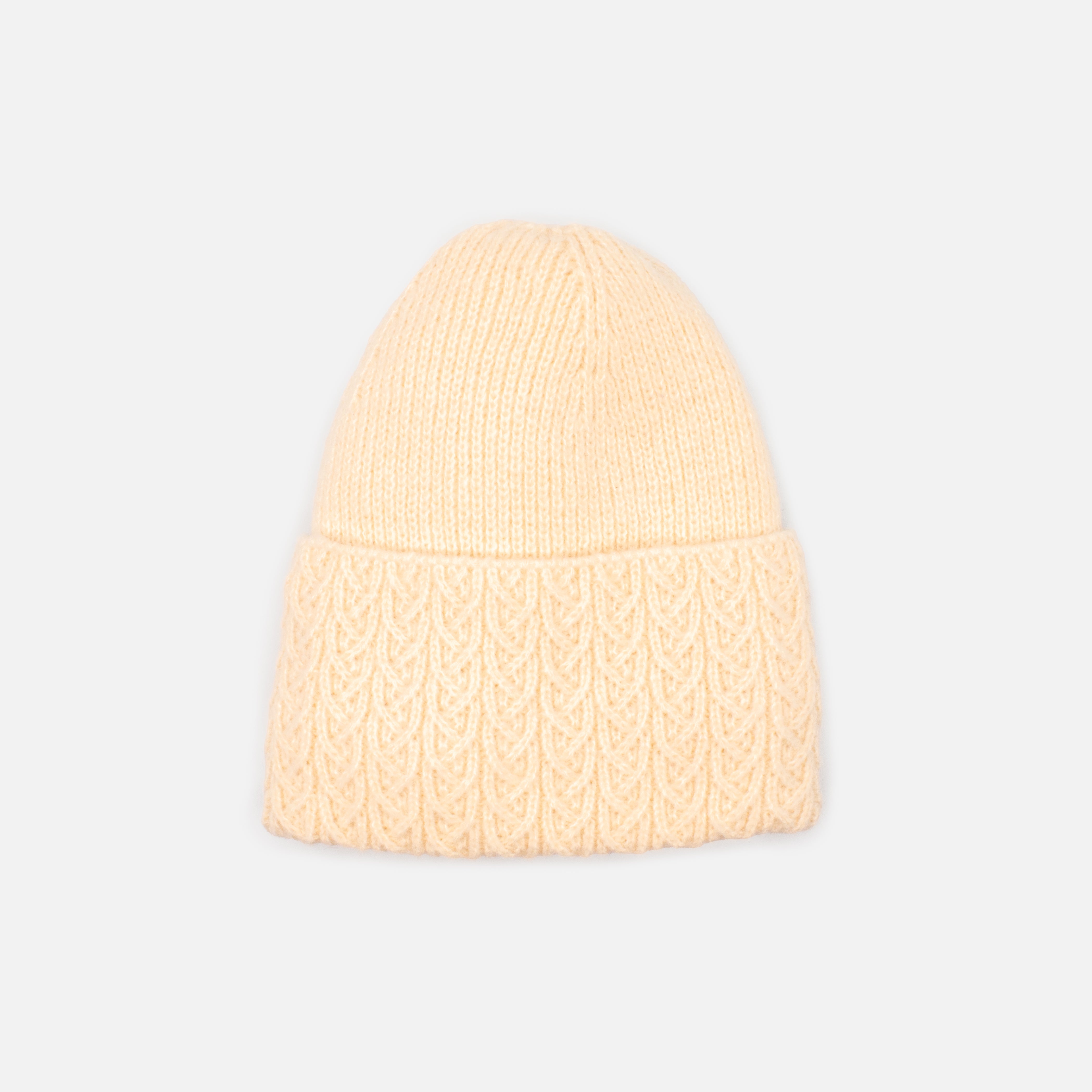 Beige knit beanie with braided flap