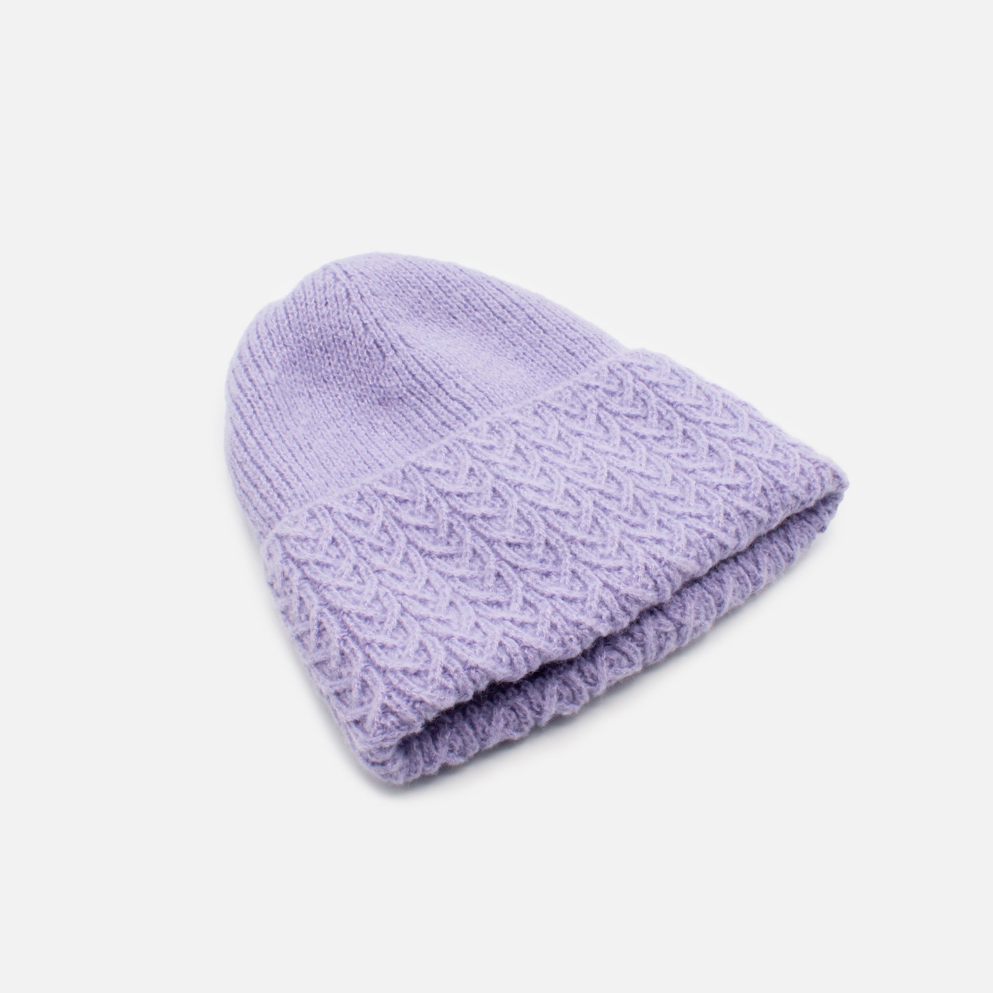 Pale purple knit beanie with braided flap