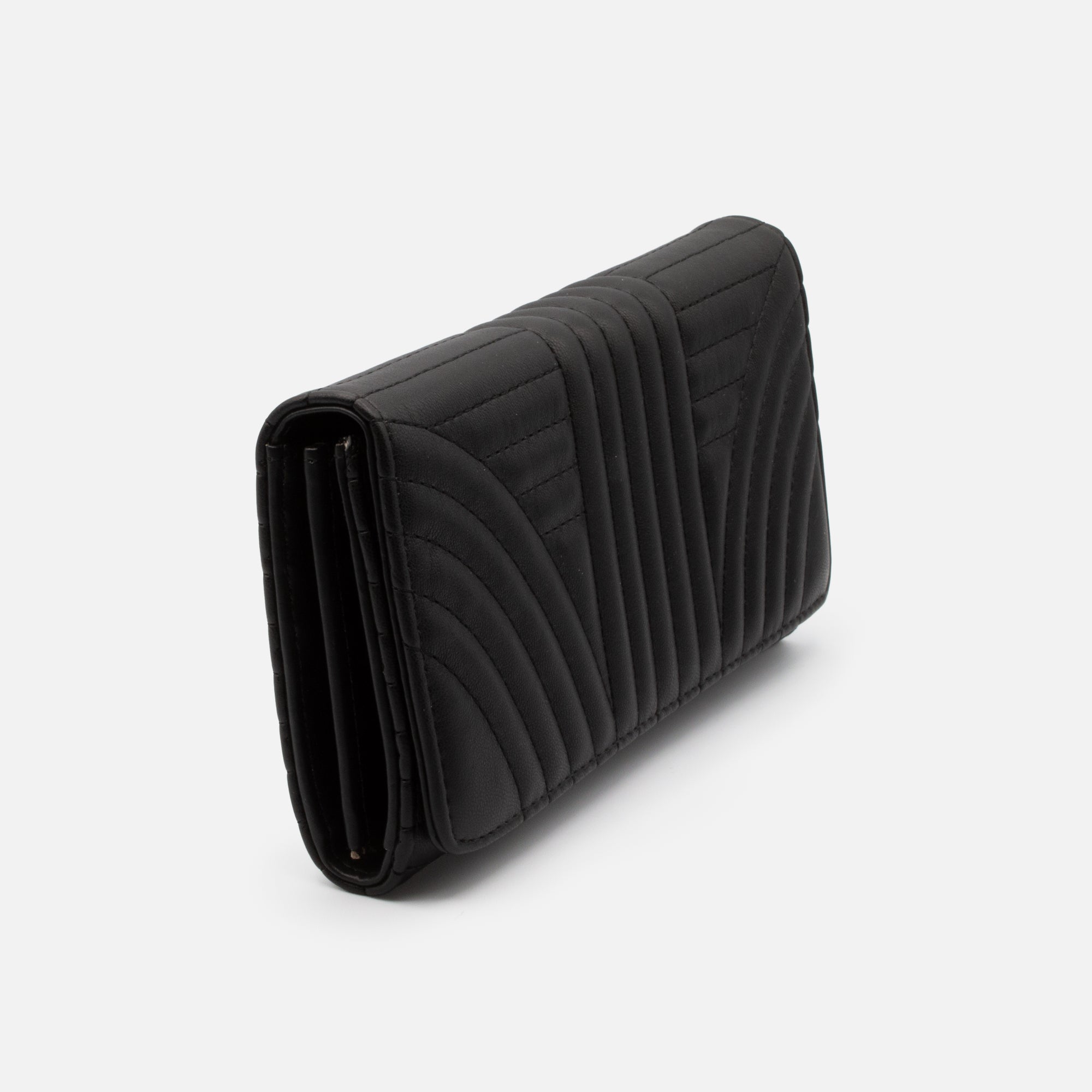 Black quilted wallet with linear patterns