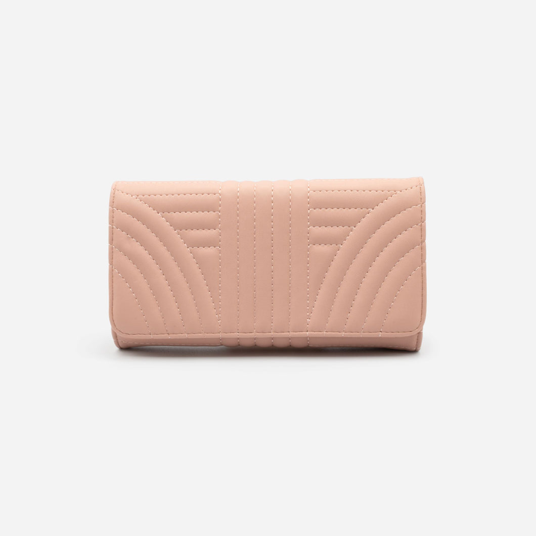 Old pink quilted wallet with linear patterns