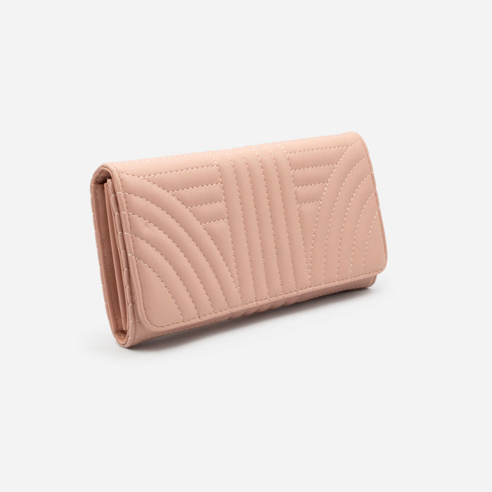 Old pink quilted wallet with linear patterns