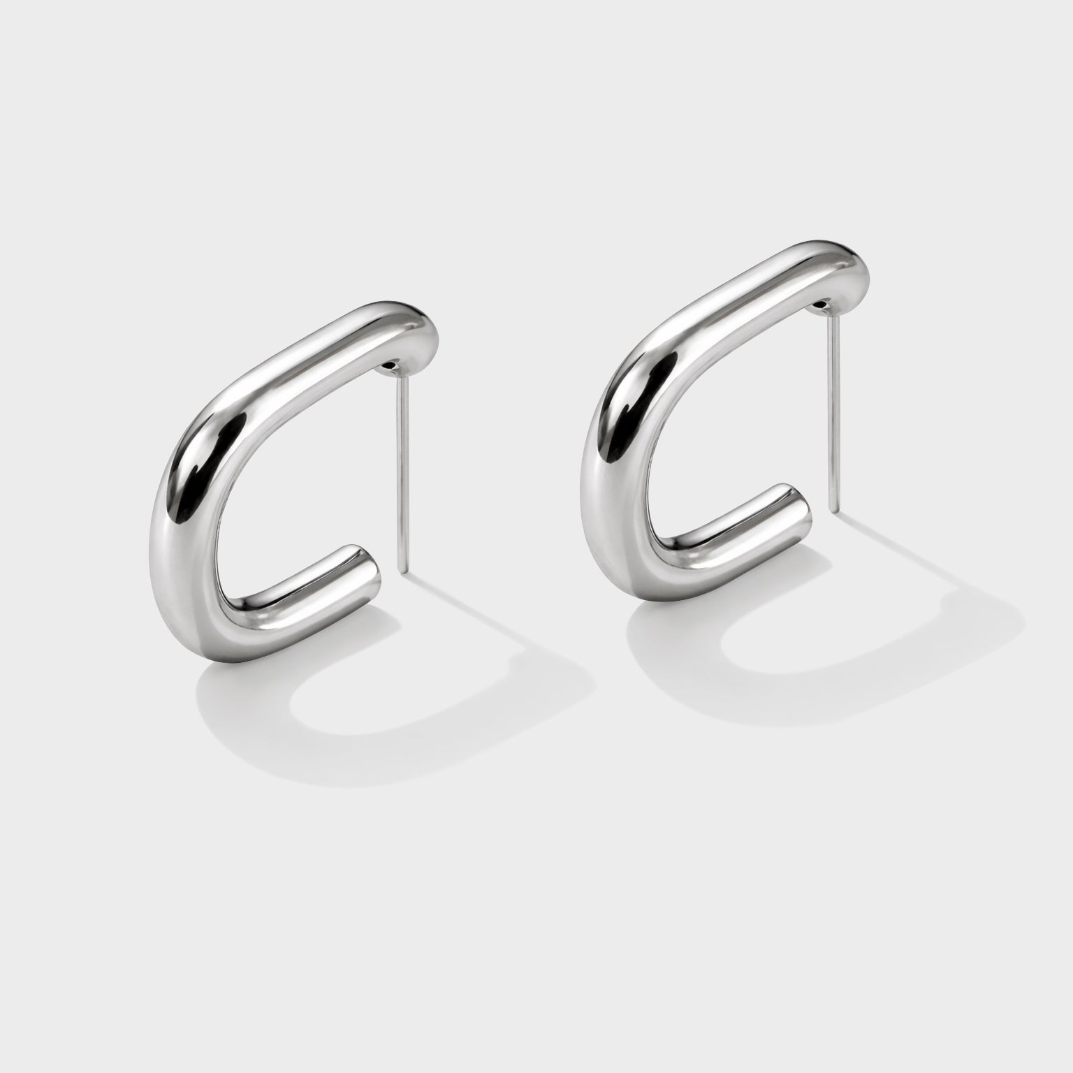 Bizou SF253E015SL – Silver large rectangular chunky hoop earrings in stainless steel, high-polish finish, angled view, Bizou jewelry
