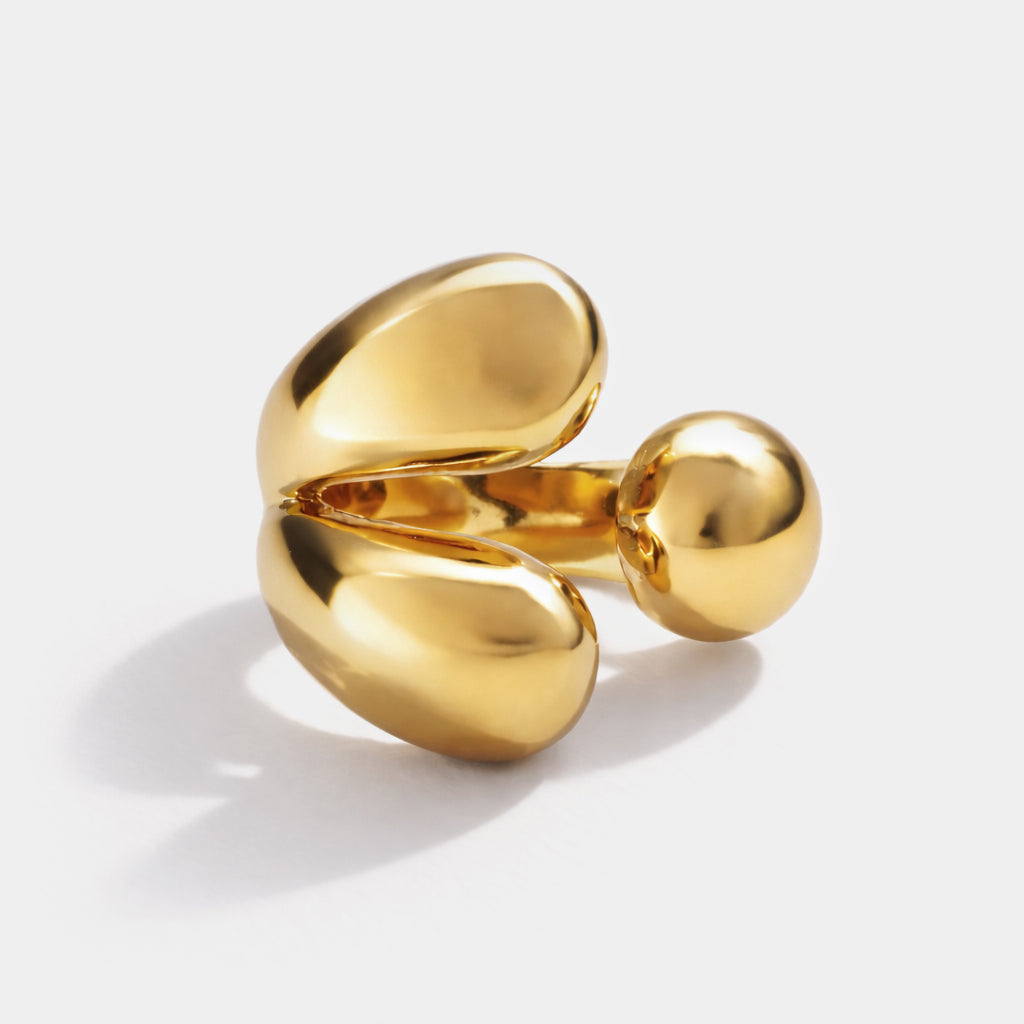 Bizou SF253R029GL – Gold chunky open sculptural statement ring in stainless steel, bold organic teardrop design, angled view, Bizou jewelry