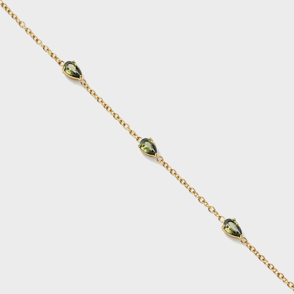 Bizou SS253B018GL – Close-up of gold stainless steel bracelet with prong-set green pear-shaped crystal charms, Bizou jewelry