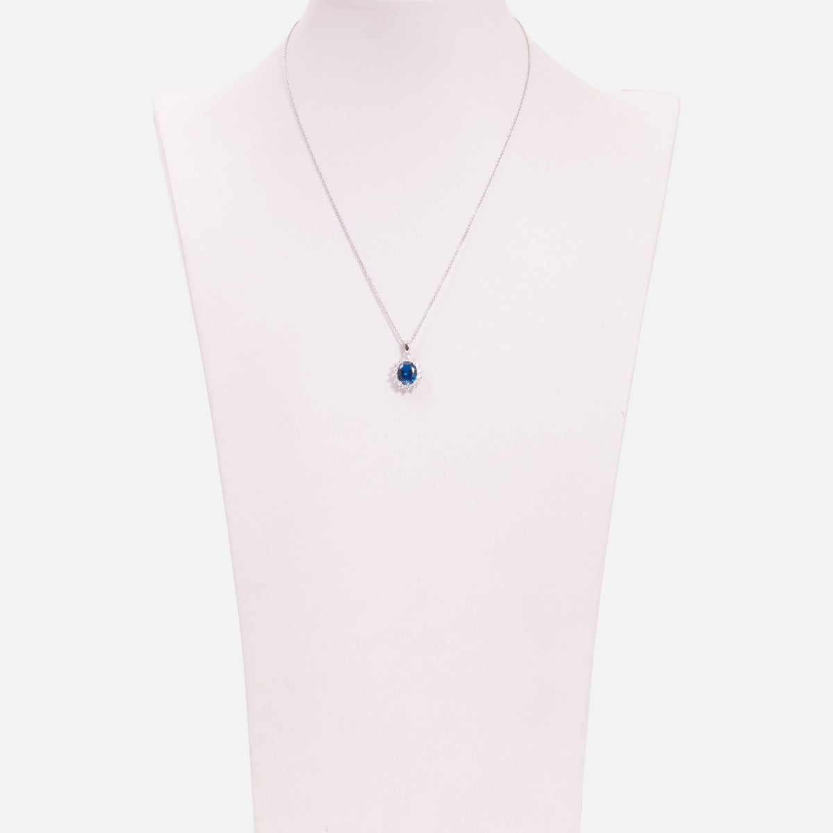 Thin sterling silver chain necklace with blue and silver cubic zirconia pendant