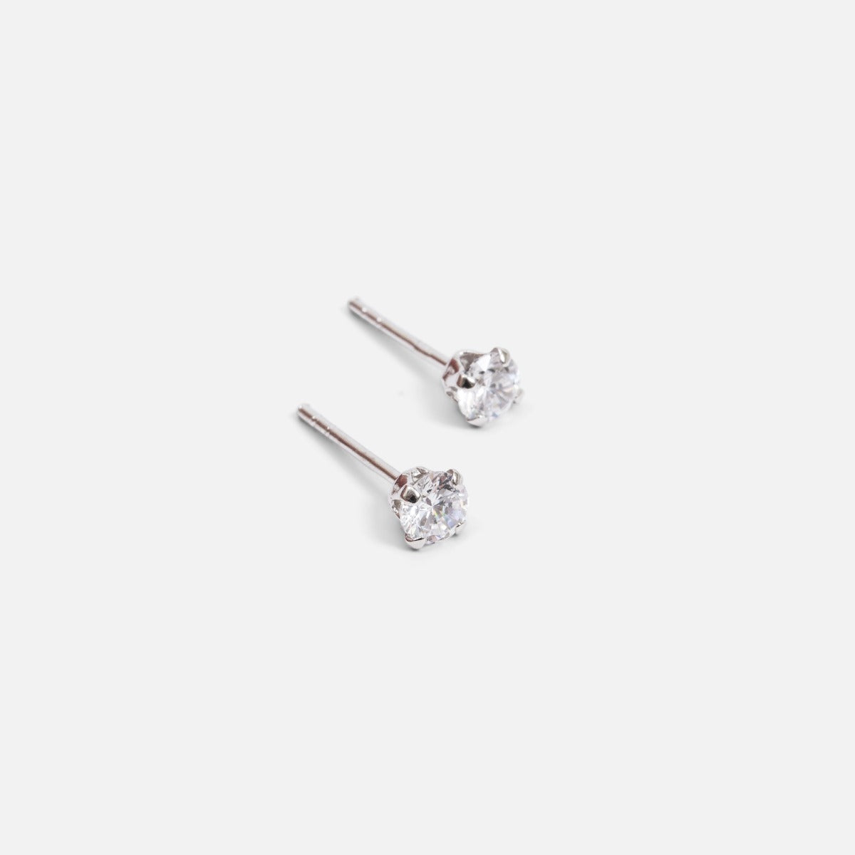 Sterling silver fixed earrings with small cubic zirconia stone