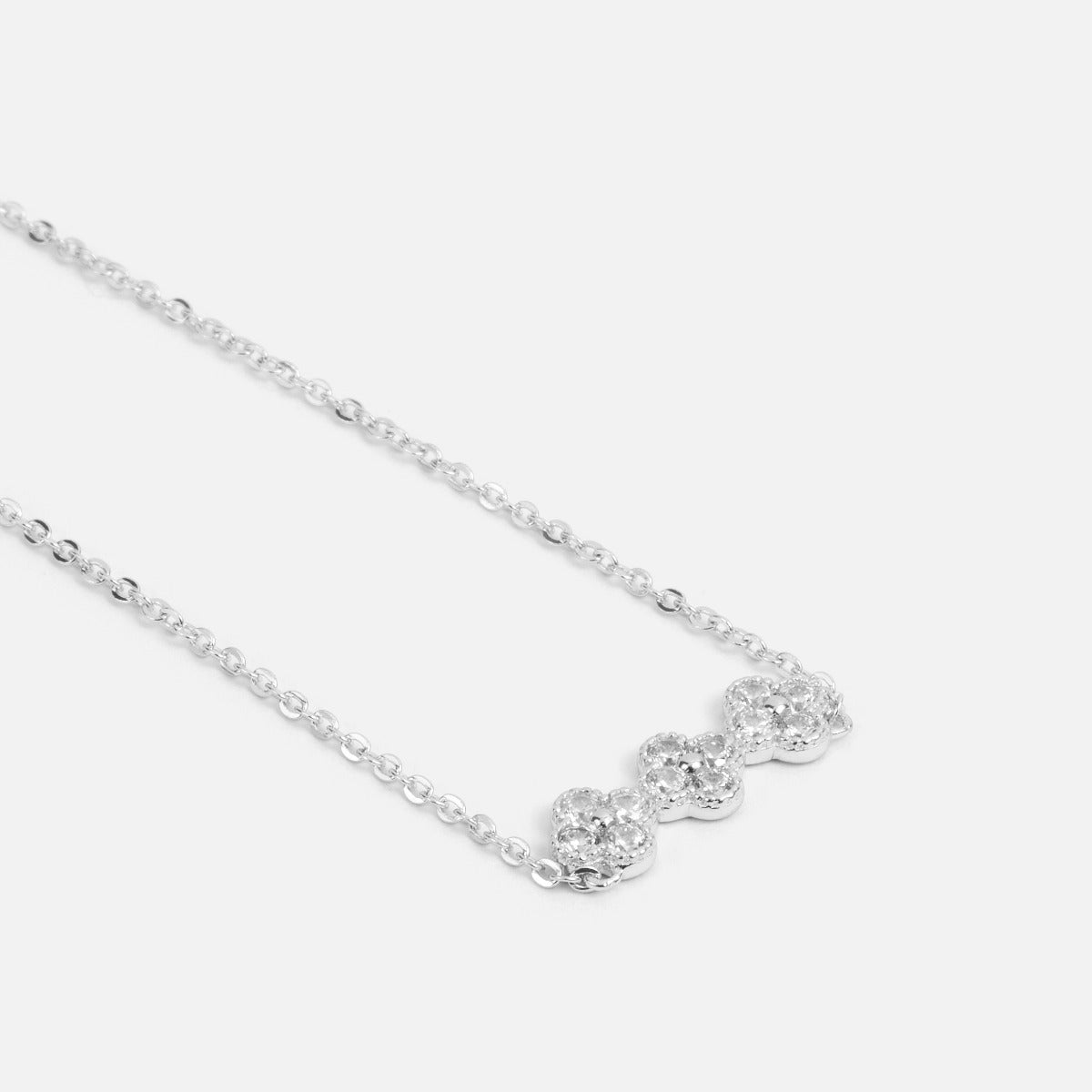 Sterling silver pendant with cubic zirconia flowers