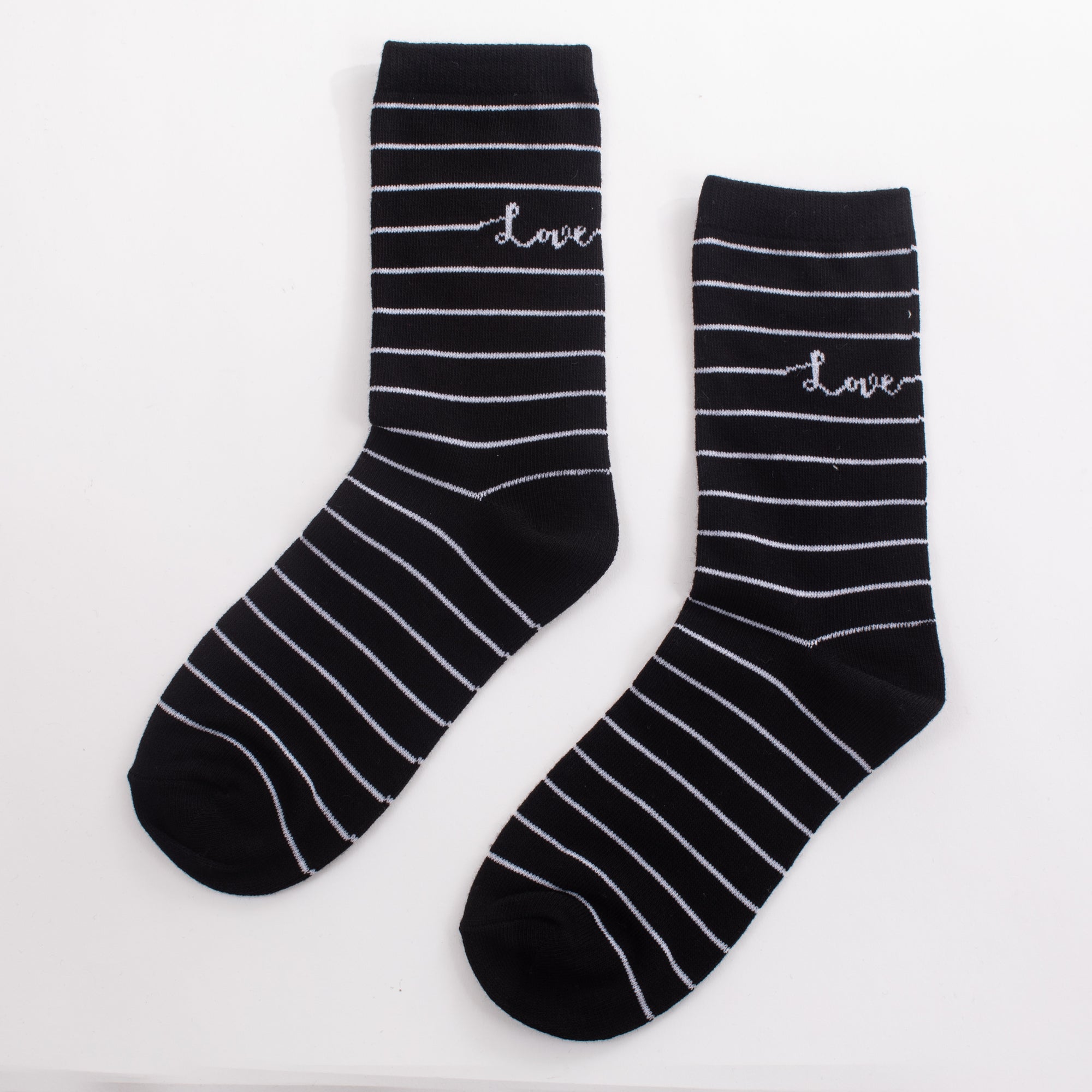 Black sockss with stripes and inscription