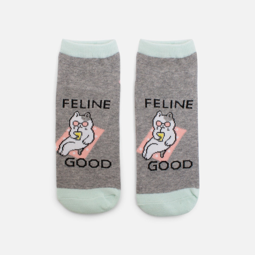 Grey socks with cat and ‘’feline good’’ inscription