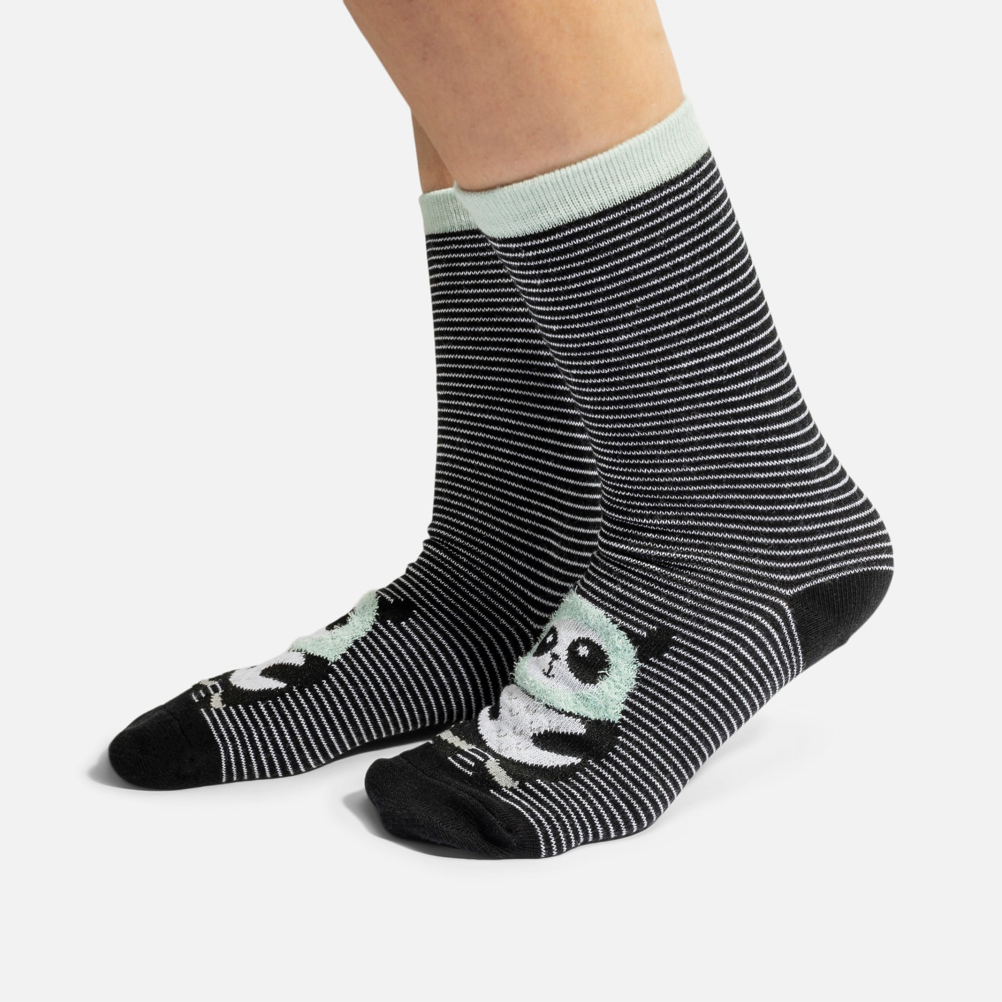 Black socks with white stripes and pandas 