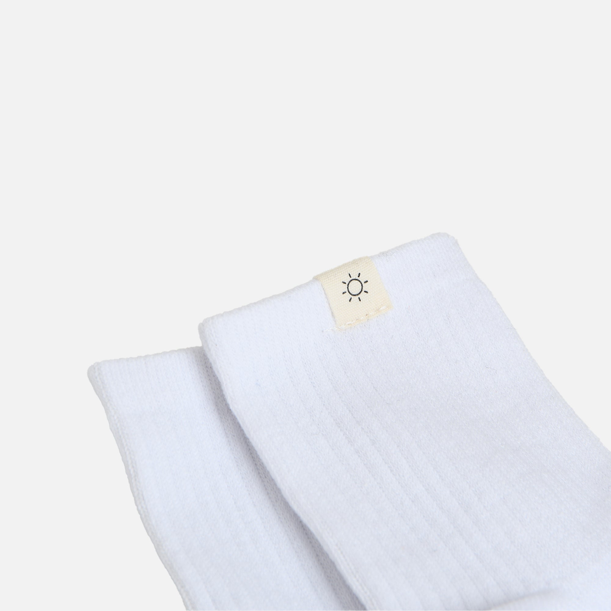 White socks with sun label