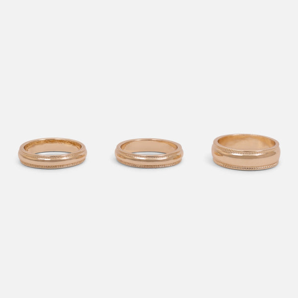 Load image into Gallery viewer, Set of three golden rings with textured effect
