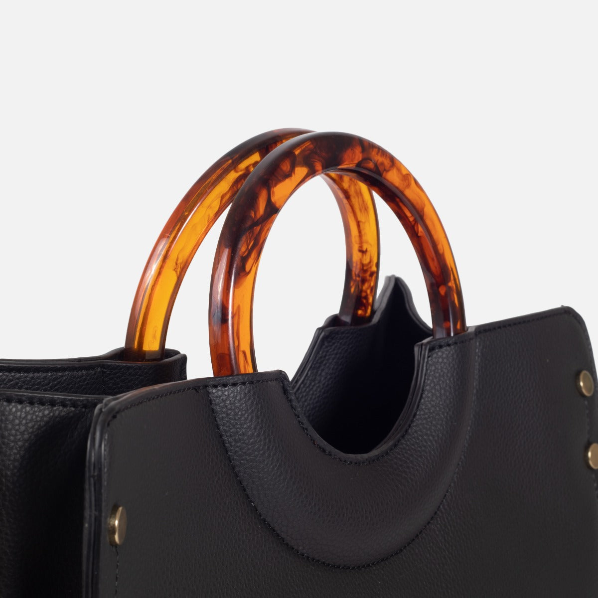 Black rigid bag with round acrylic handles