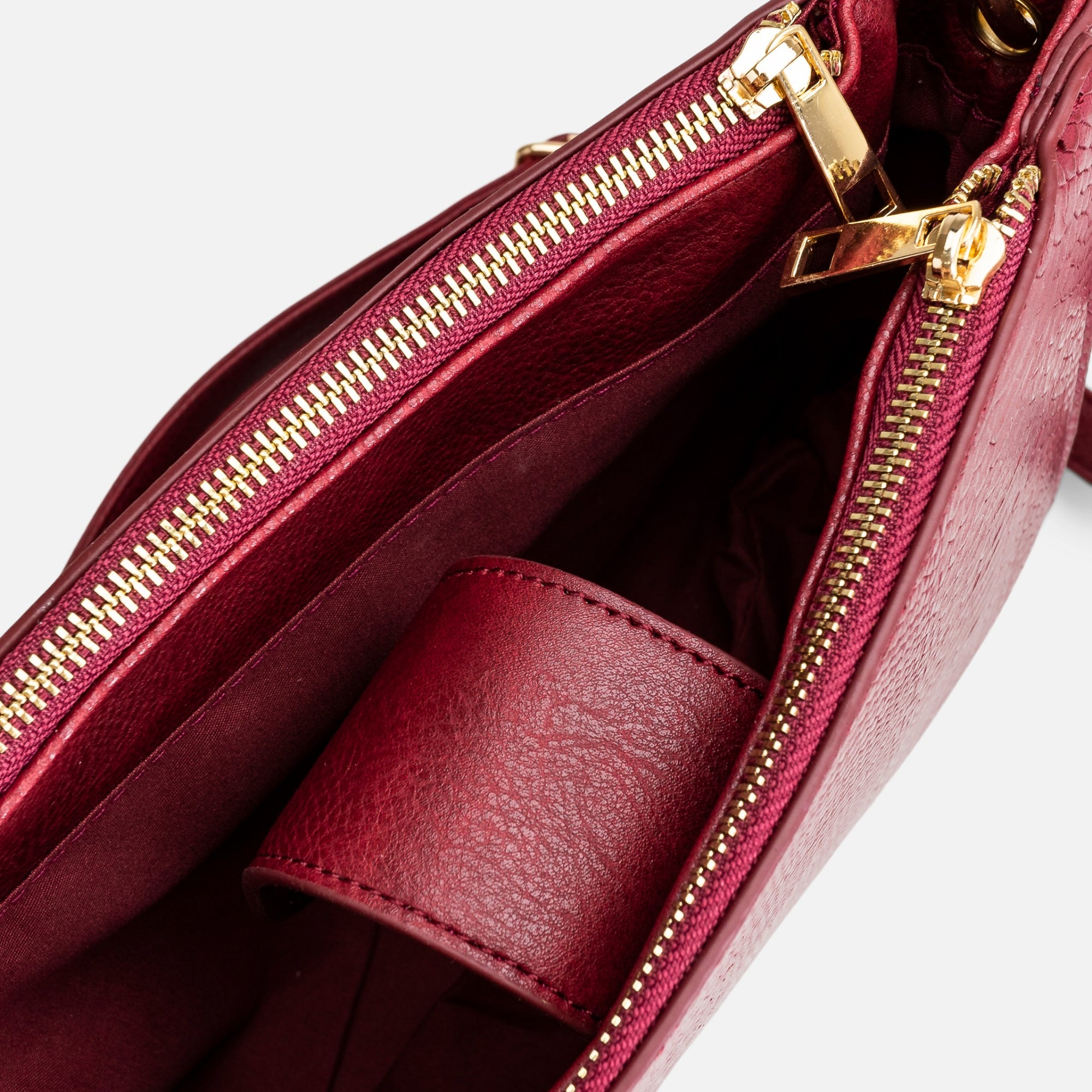 Burgundy shoulder bag with snake pattern effect