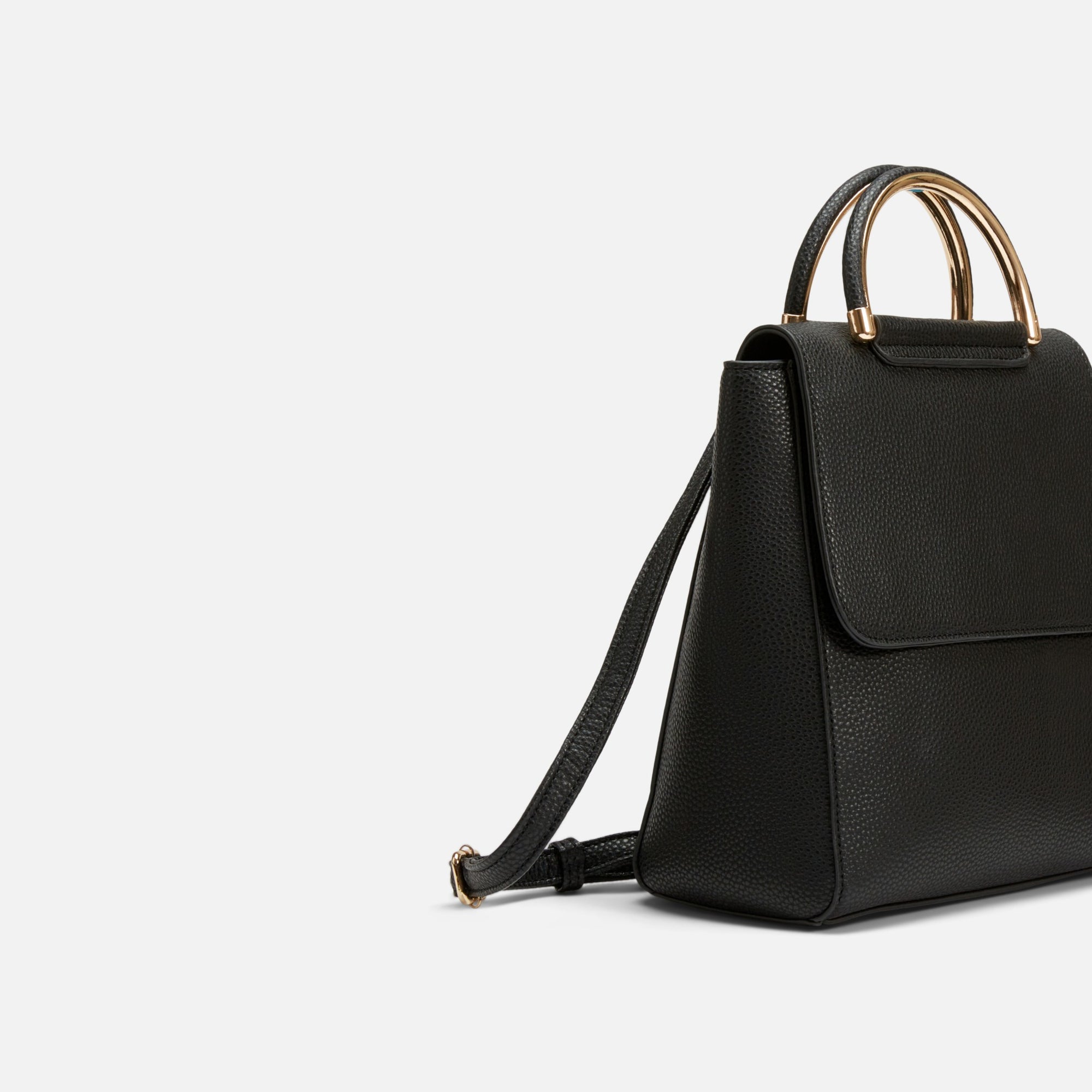 Black backpack with gold handle
