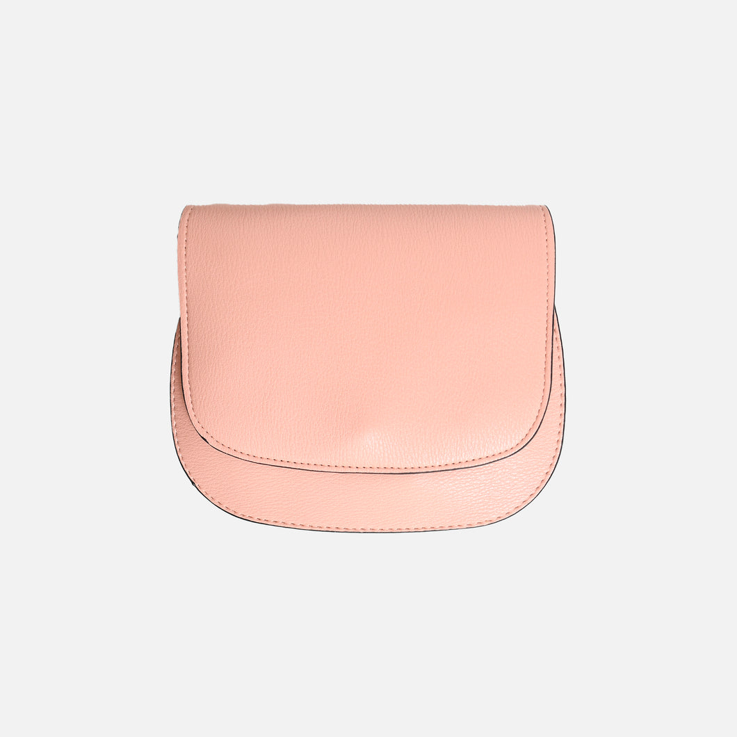 Round pink handbag with shoulder strap