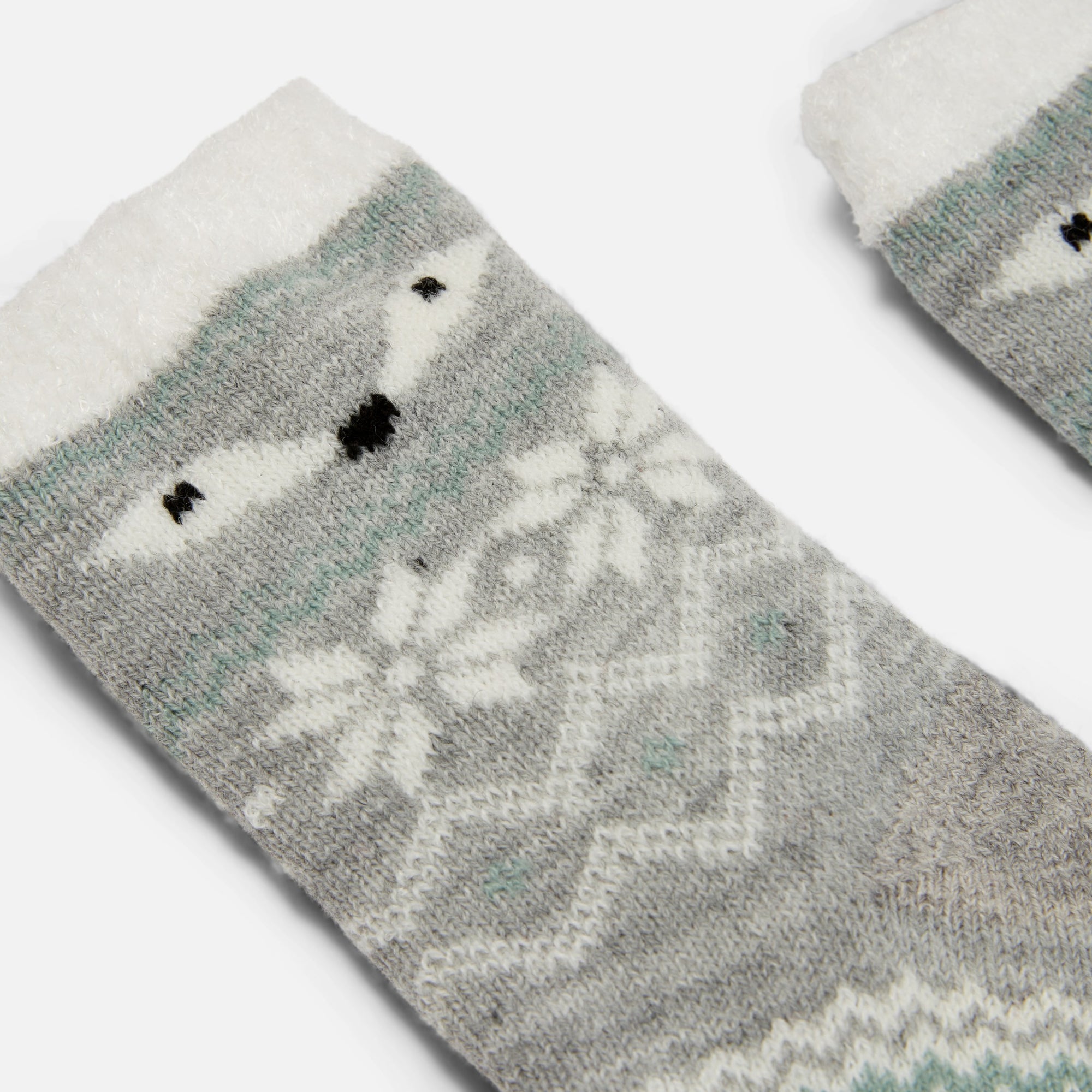 Grey cozy socks with norwegian patterns and fox faces