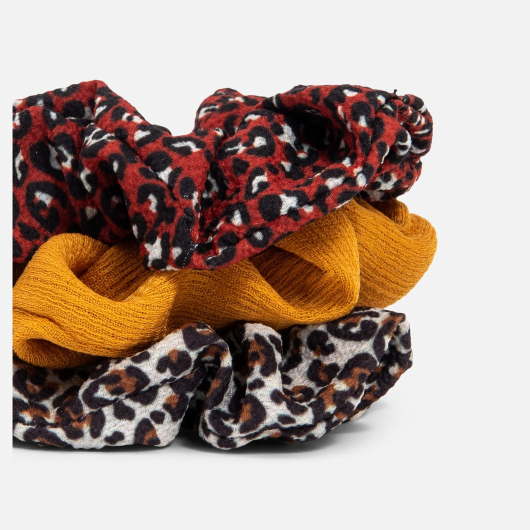 Set of three animal print scrunchies.