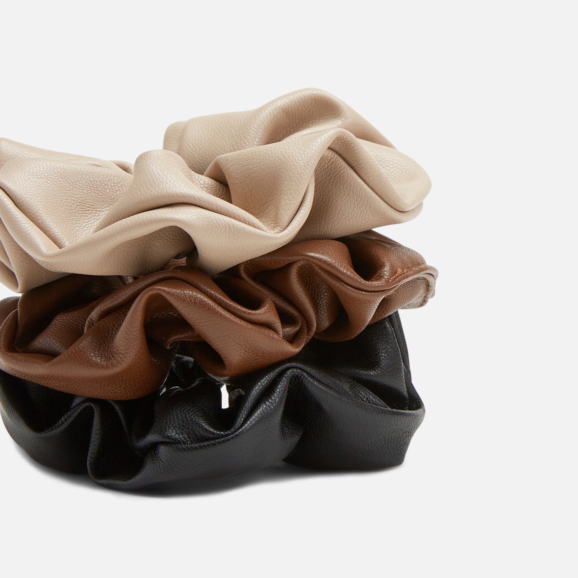 Set of three scrunchies in beige, camel and black leatherette