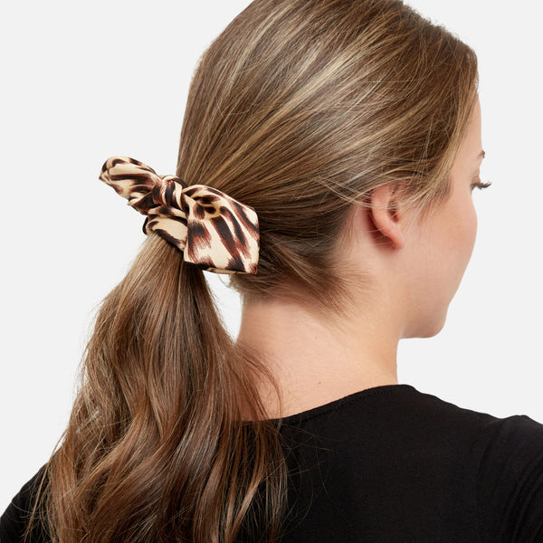 Load image into Gallery viewer, Set of 2 scrunchies in black and animal print with bows
