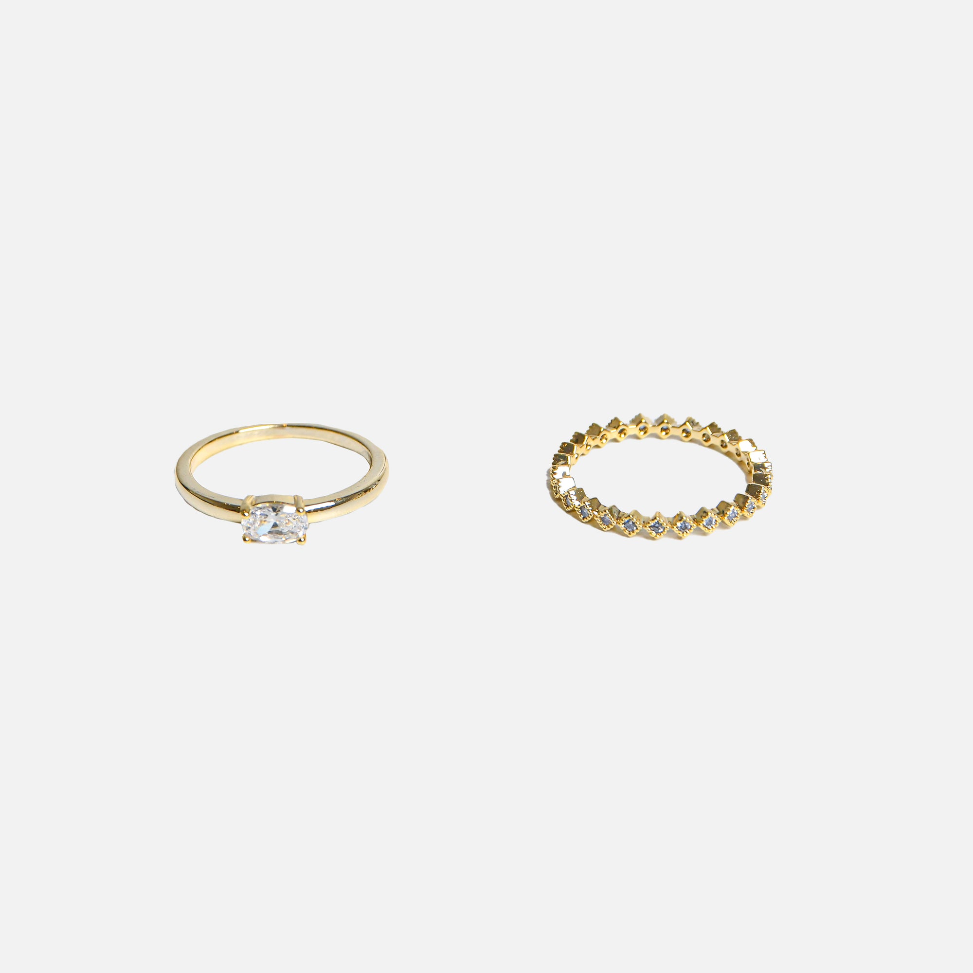 Duo of golden rings small stones and solitaire stone