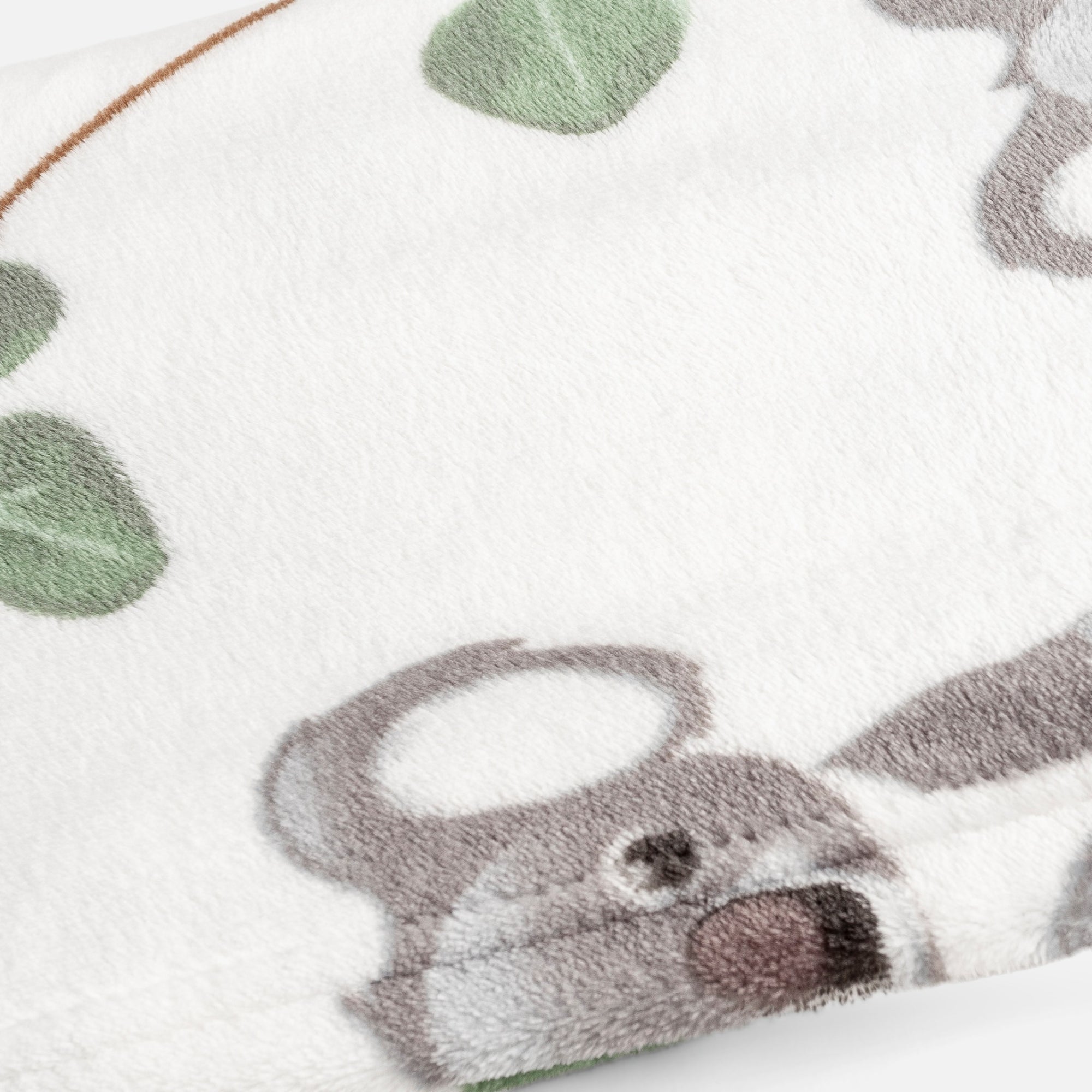 Soft ivory throw with koala print