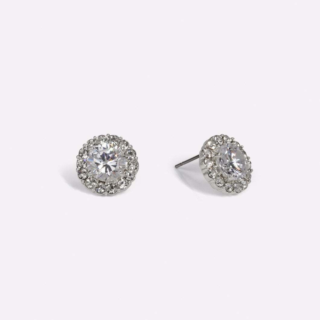 Earrings with a diamond cut stone surrounded by small sparkling stones