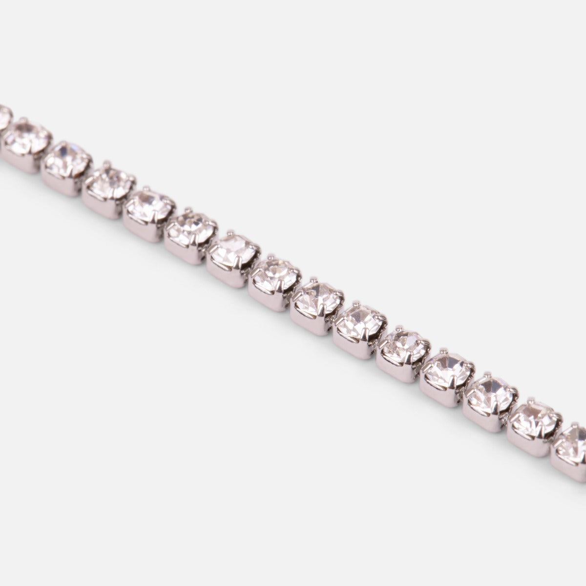 Silvered ankle chain with small sparkling stones