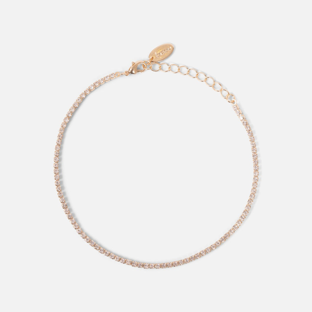 Thin golden ankle chain with small sparkling stones