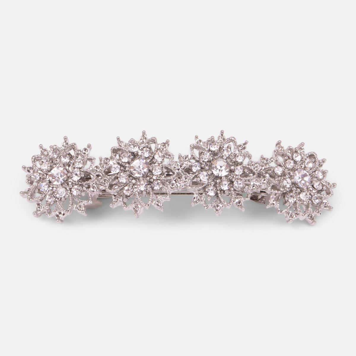 Silvered barrette with 4 floral ornaments