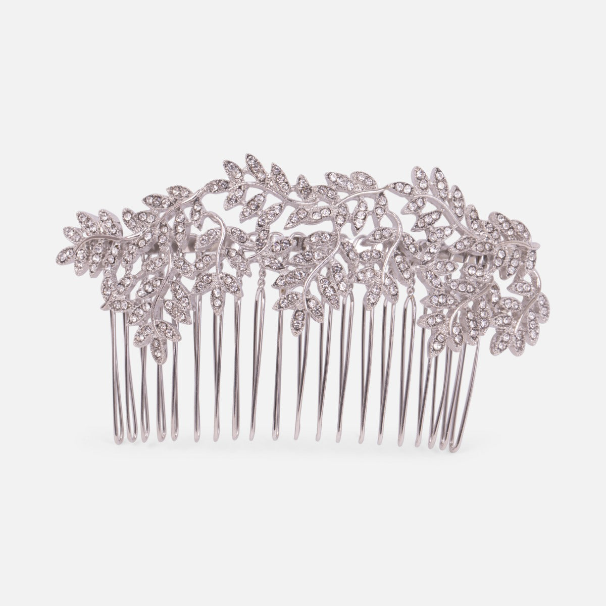 Decorative silvered comb with leaf ornaments