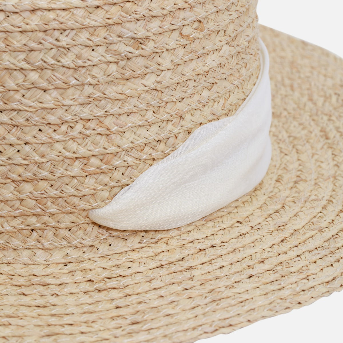 Beige boater straw hat with pale ribbon