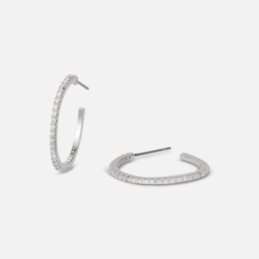 Open hoop earrings with small cubic zirconia stones   