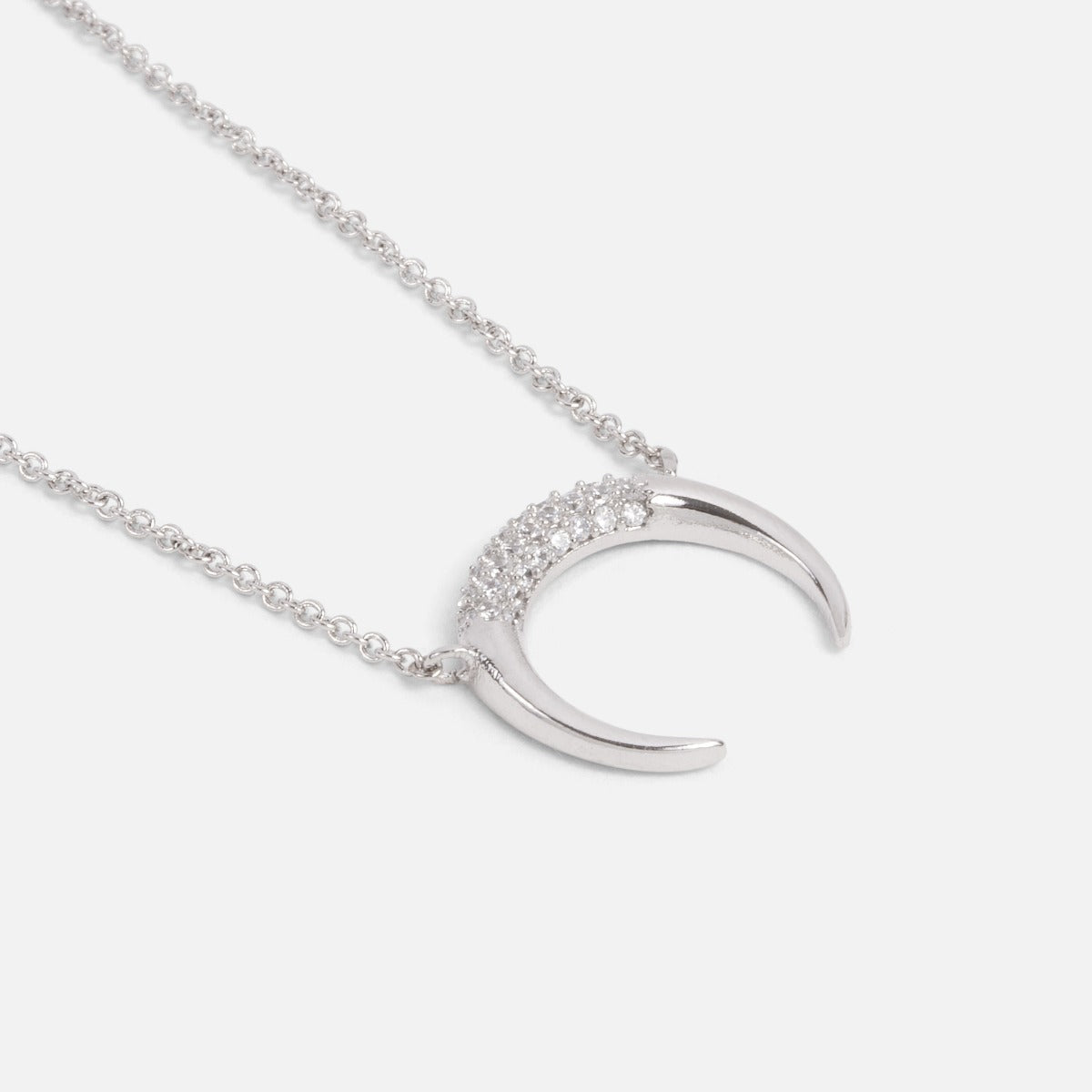 Silvered horn pendant with small cubic zirconia stones