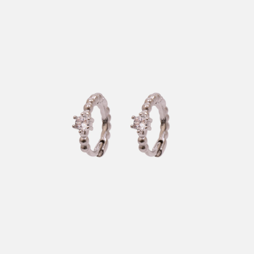 Set of three silvered fixed and hoop earrings