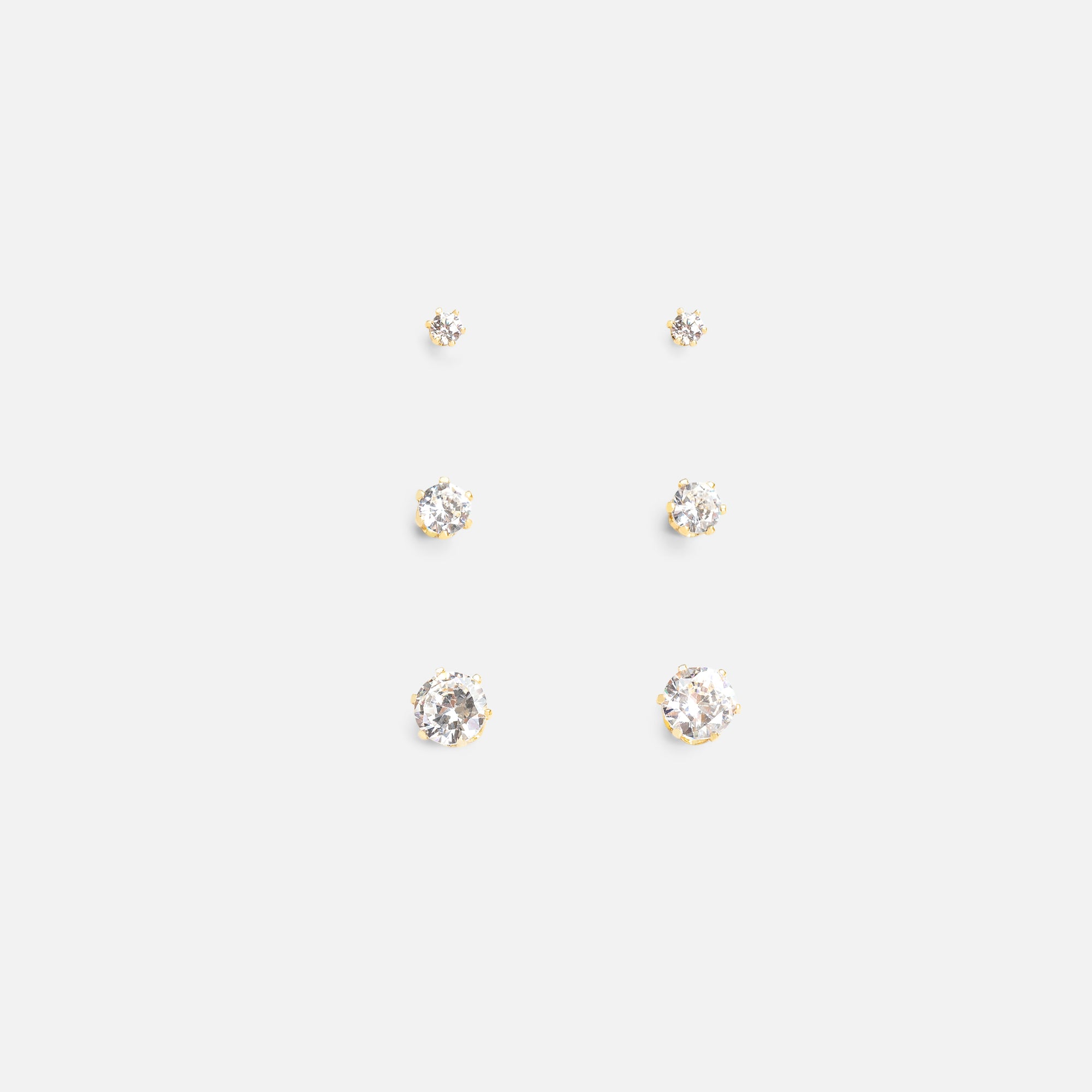 Set of three gold earrings with cubic zirconia