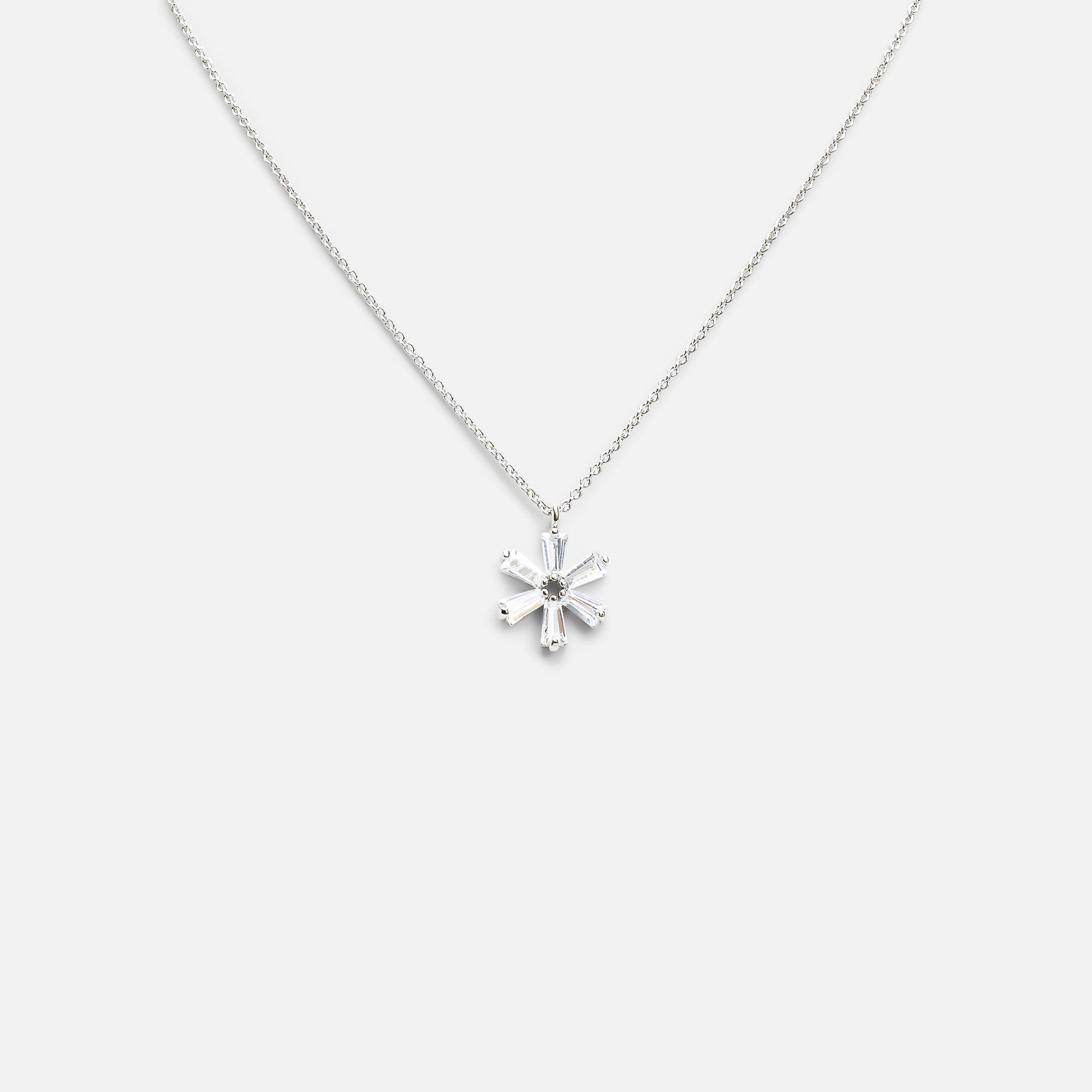 Silver pendant with small flower